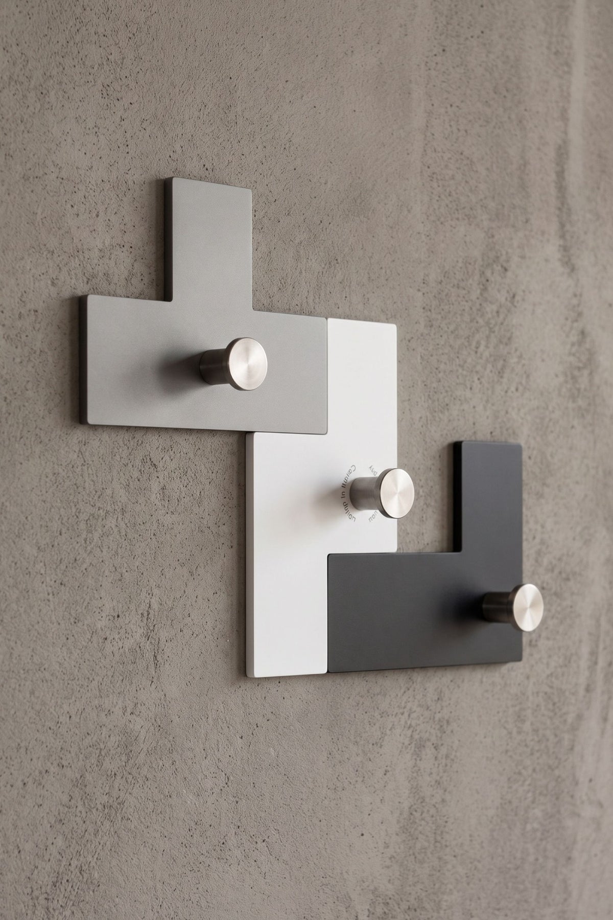 UTUT-3 modular coat rack mounted on a wall, close-up of the three hook elements
