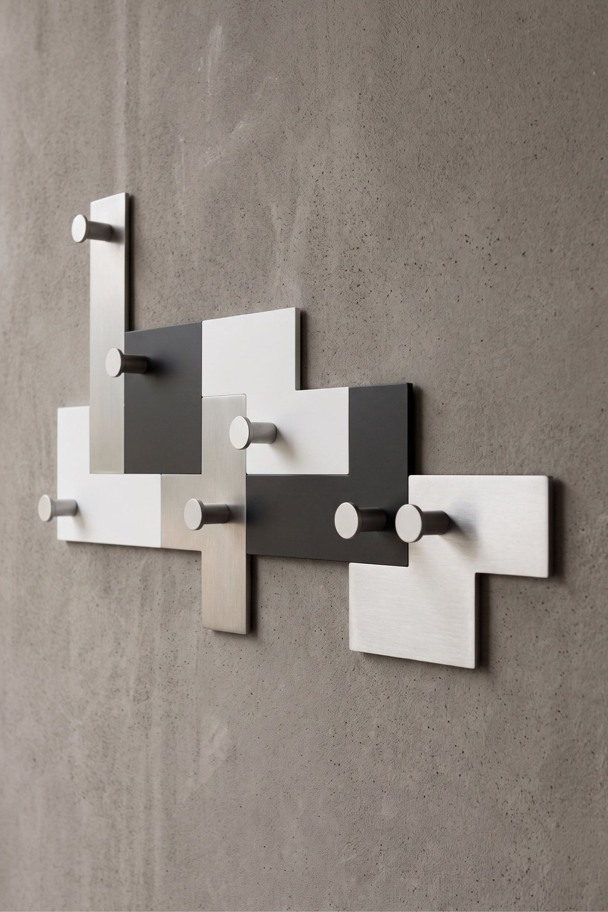 UTUT-7 modular coat rack installed on a wall, detail of seven separate hook elements