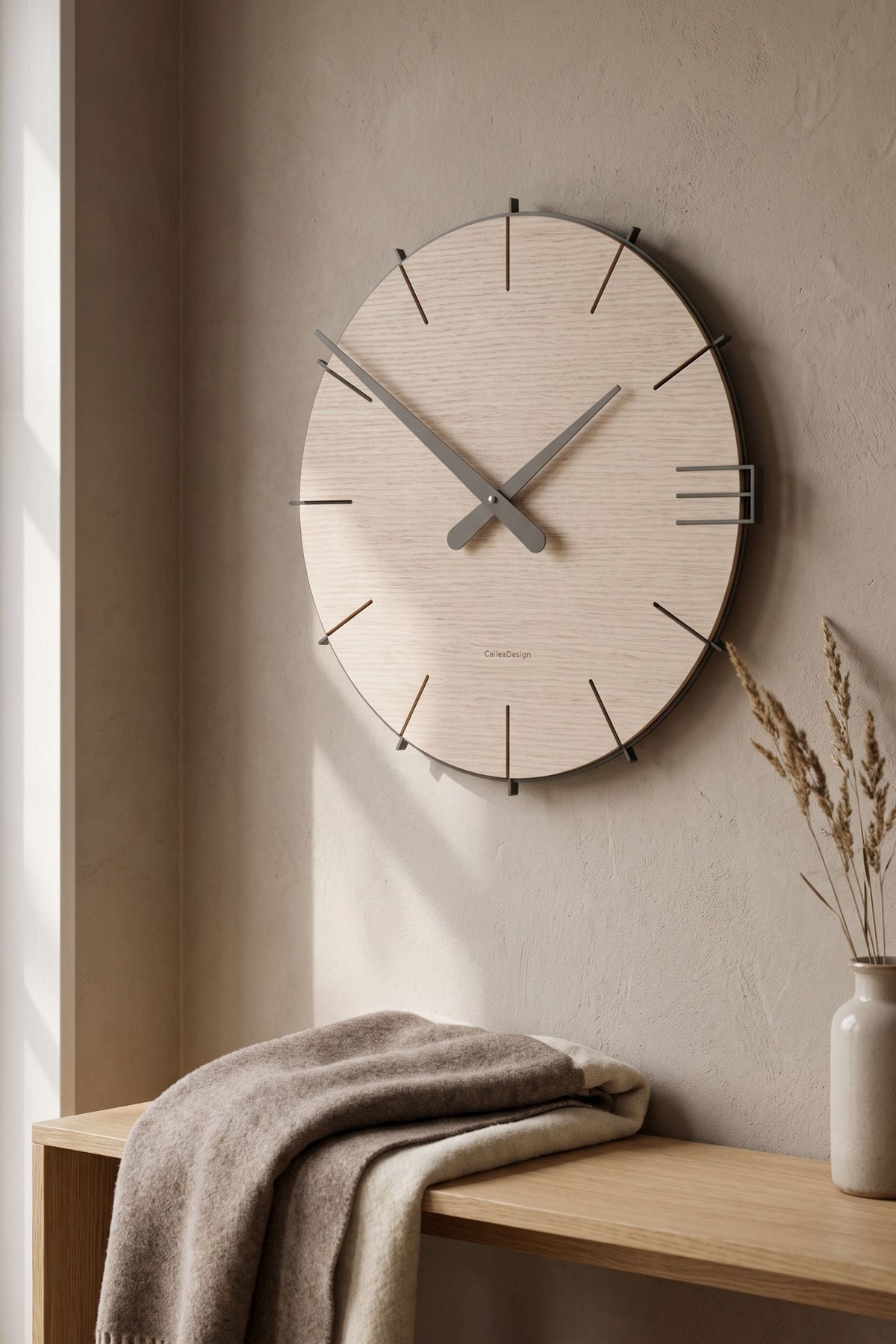 CalleaDesign Mike wall clock in Silk Mist finish in a contemporary interior