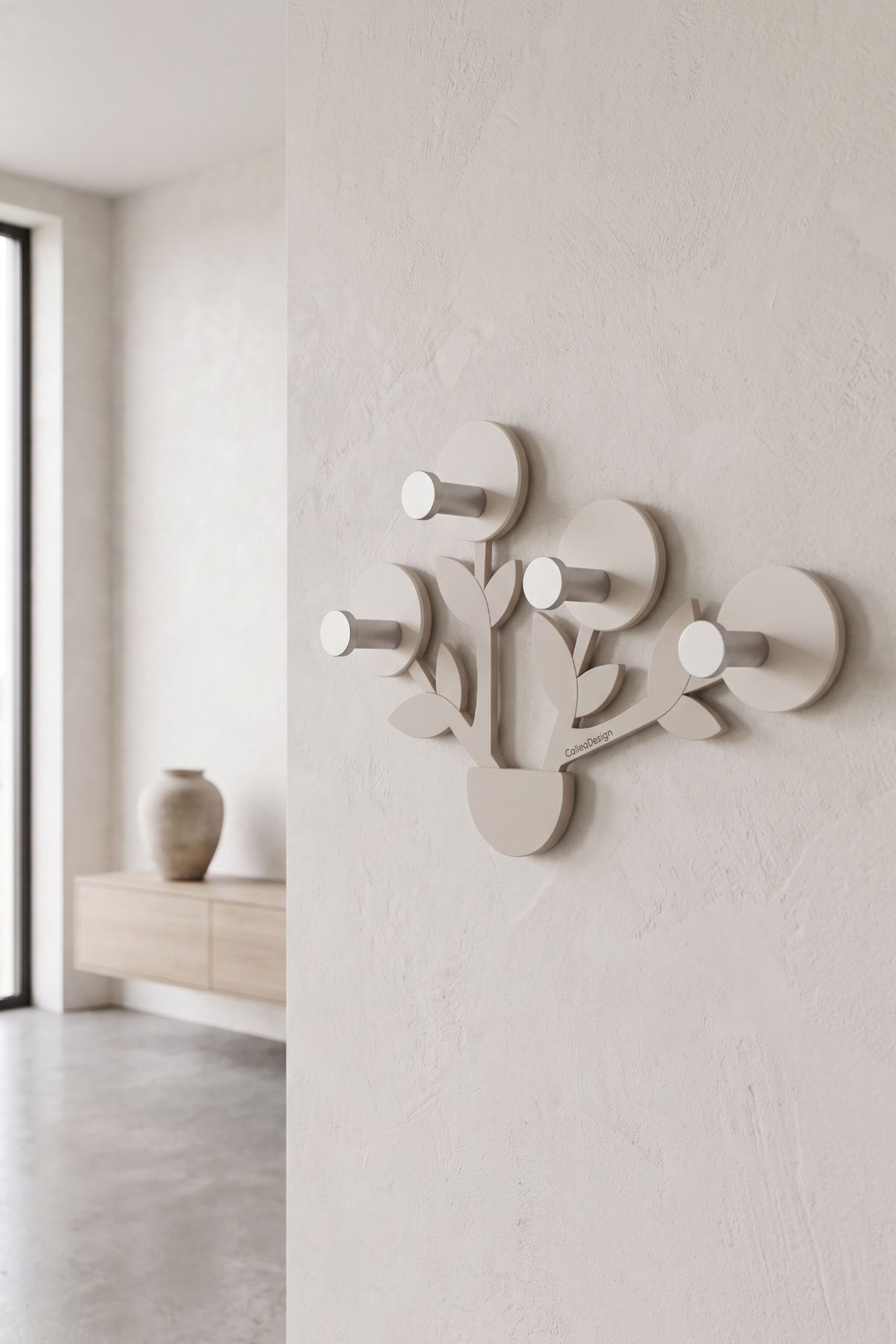 Francine wall-mounted coat rack with four hooks in a contemporary interior