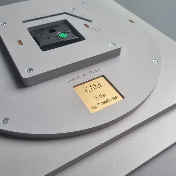 Back of the KAM Sole wall clock with engraved CalleaDesign signature and movement
