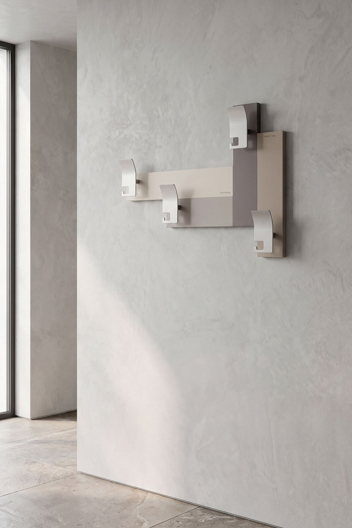 Stripes 80 wall-mounted coat rack with four metal hooks in a contemporary entrance